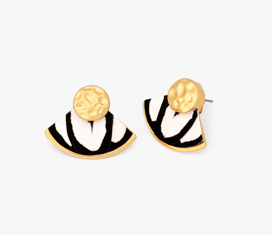 Pair of gold earrings with fan-shaped inlay of black and white feathers on a white background