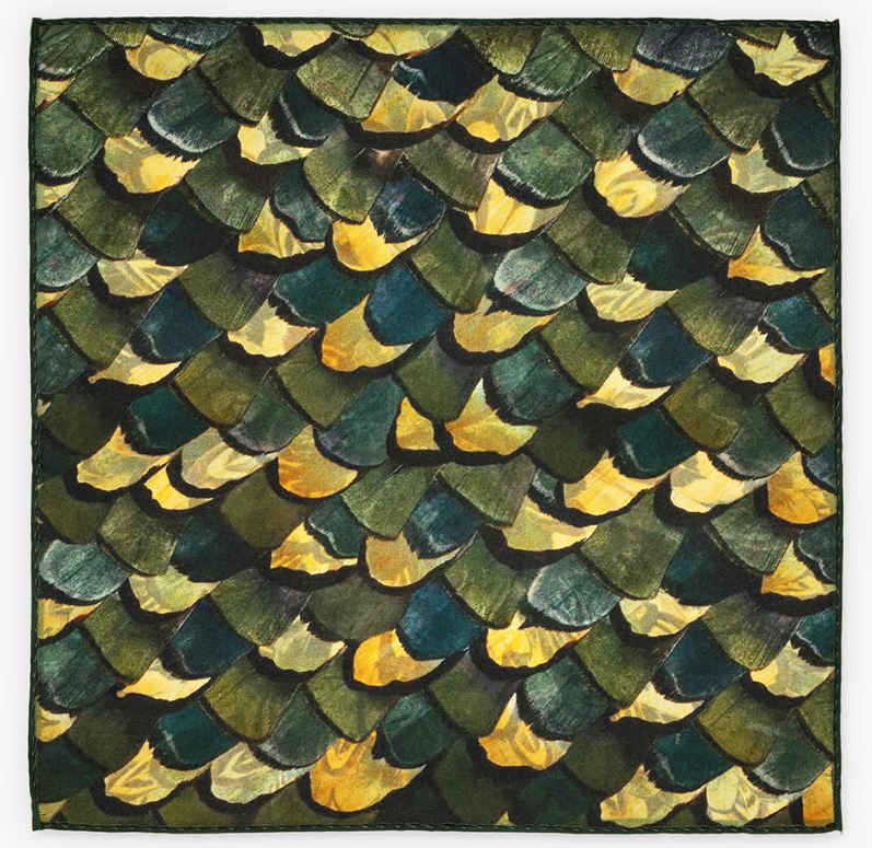 Unfolded reverse side of pocket square featuring an alternate green and yellow pattern resembling fish scales.