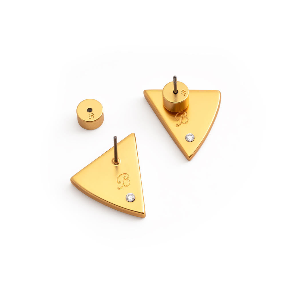 Gold triangle-shaped earrings with a small round earring back on a white background