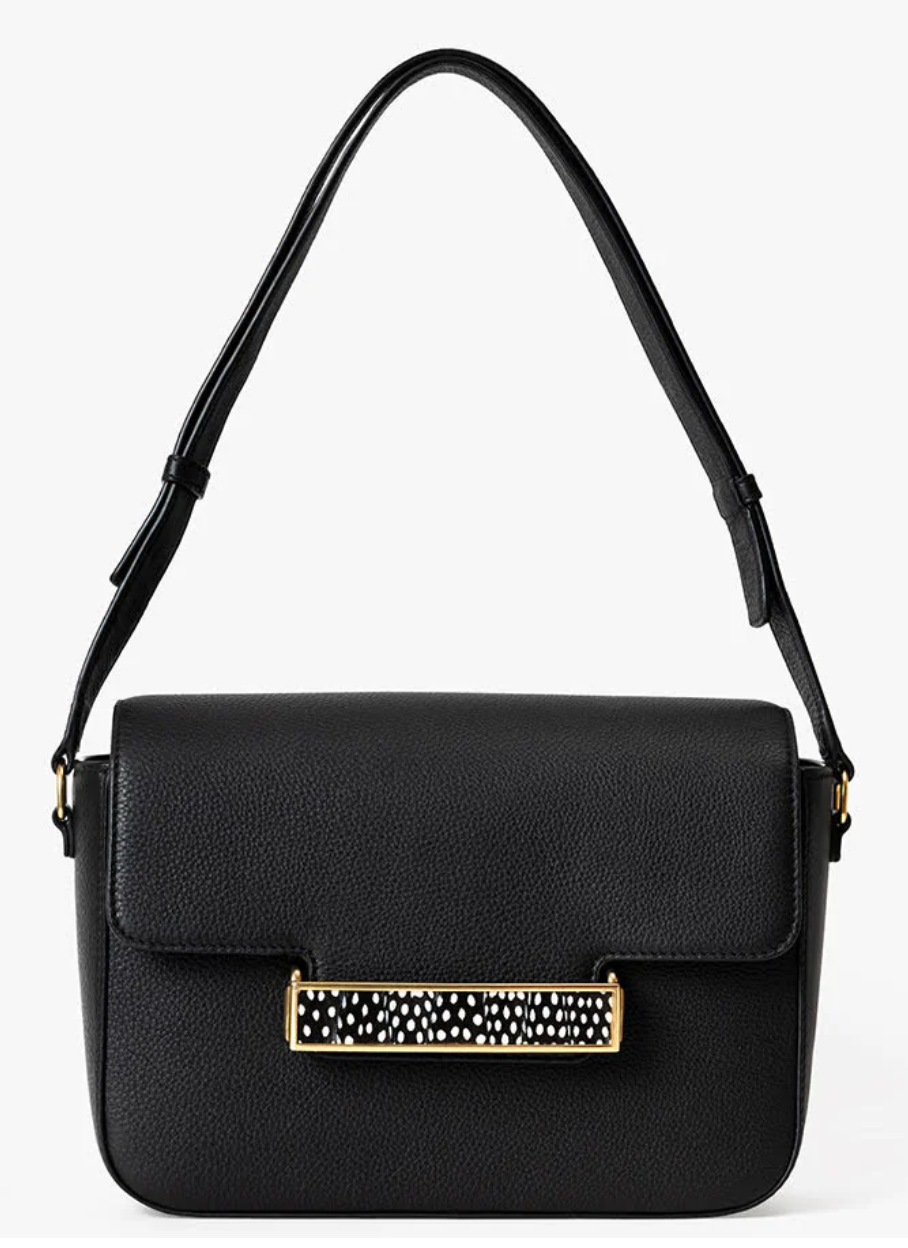 Black leather handbag with gold clasp featuring a black and white feather inlay on a white background