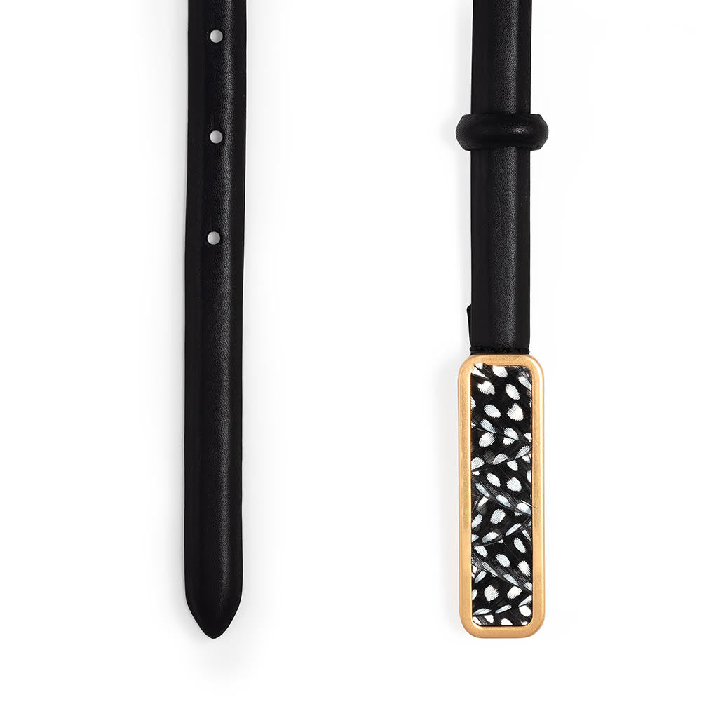 Ends of black belt size large with a black and white patterned buckle on a white background.