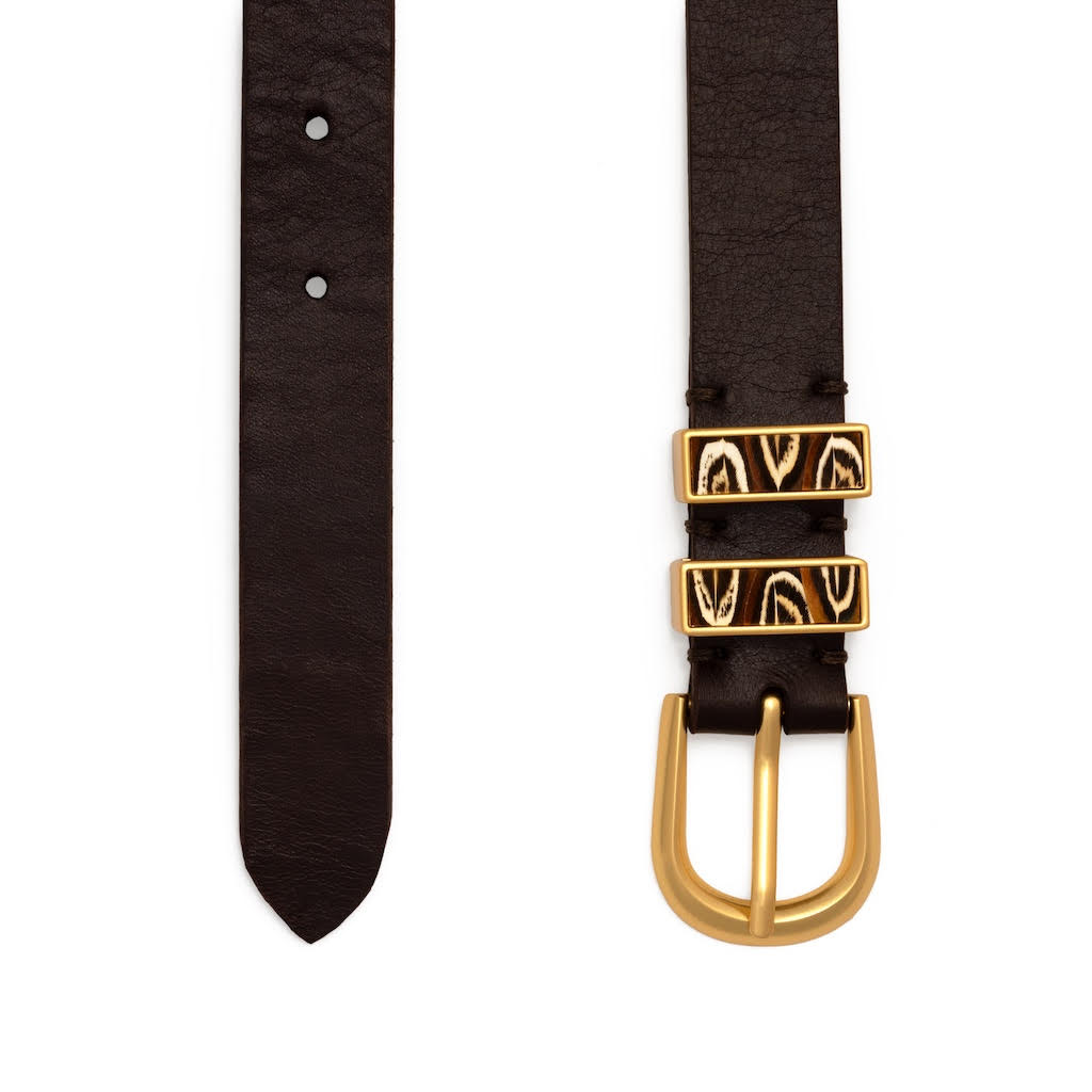 Brown leather belt with gold buckle and feather inlay on a white background