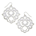 Silver filigree earrings on a white background