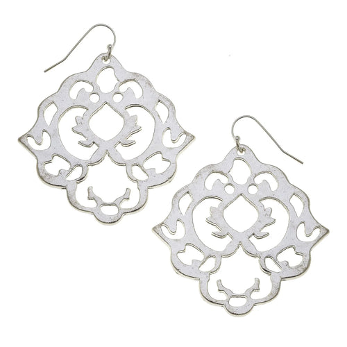 Silver filigree earrings on a white background