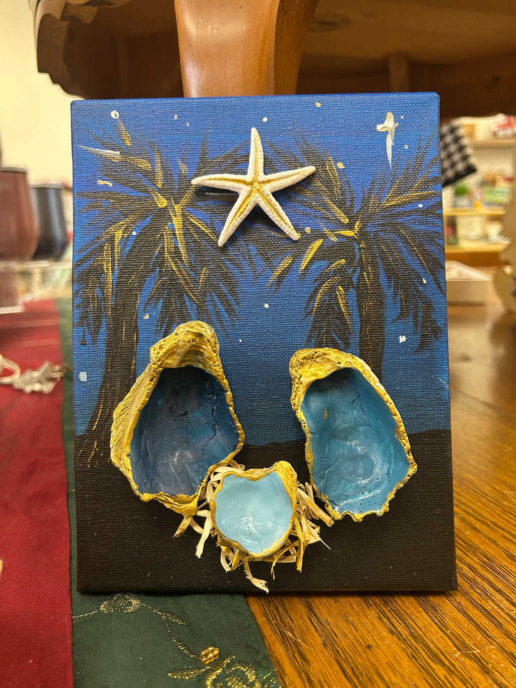 Oyster art Nativity with palm trees