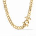 A gold chain necklace with an ornate clasp with pearls on a white background