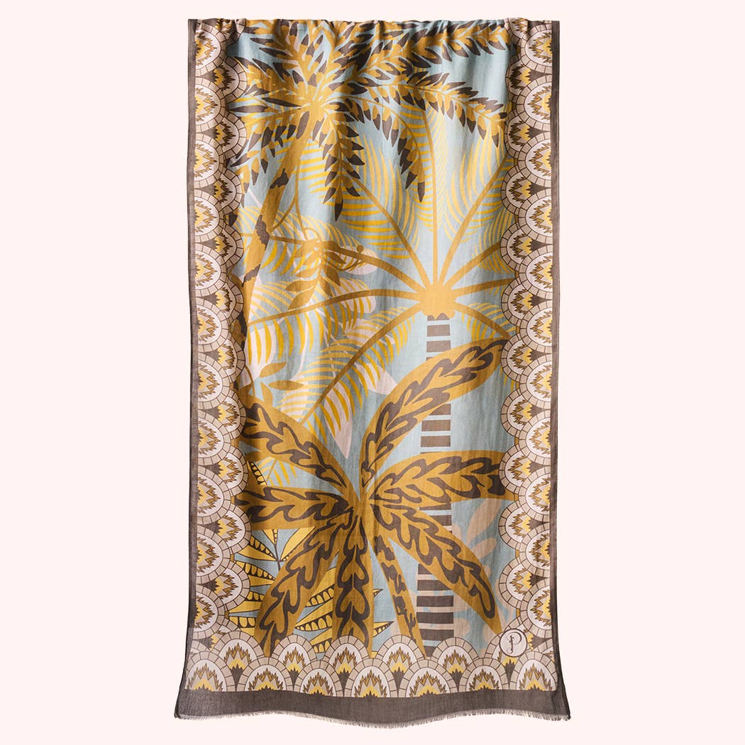 Scarf with a brown and yellow palm leaf pattern on a white background