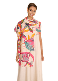 Woman wearing a colorful scarf with a floral and animal pattern on a white background