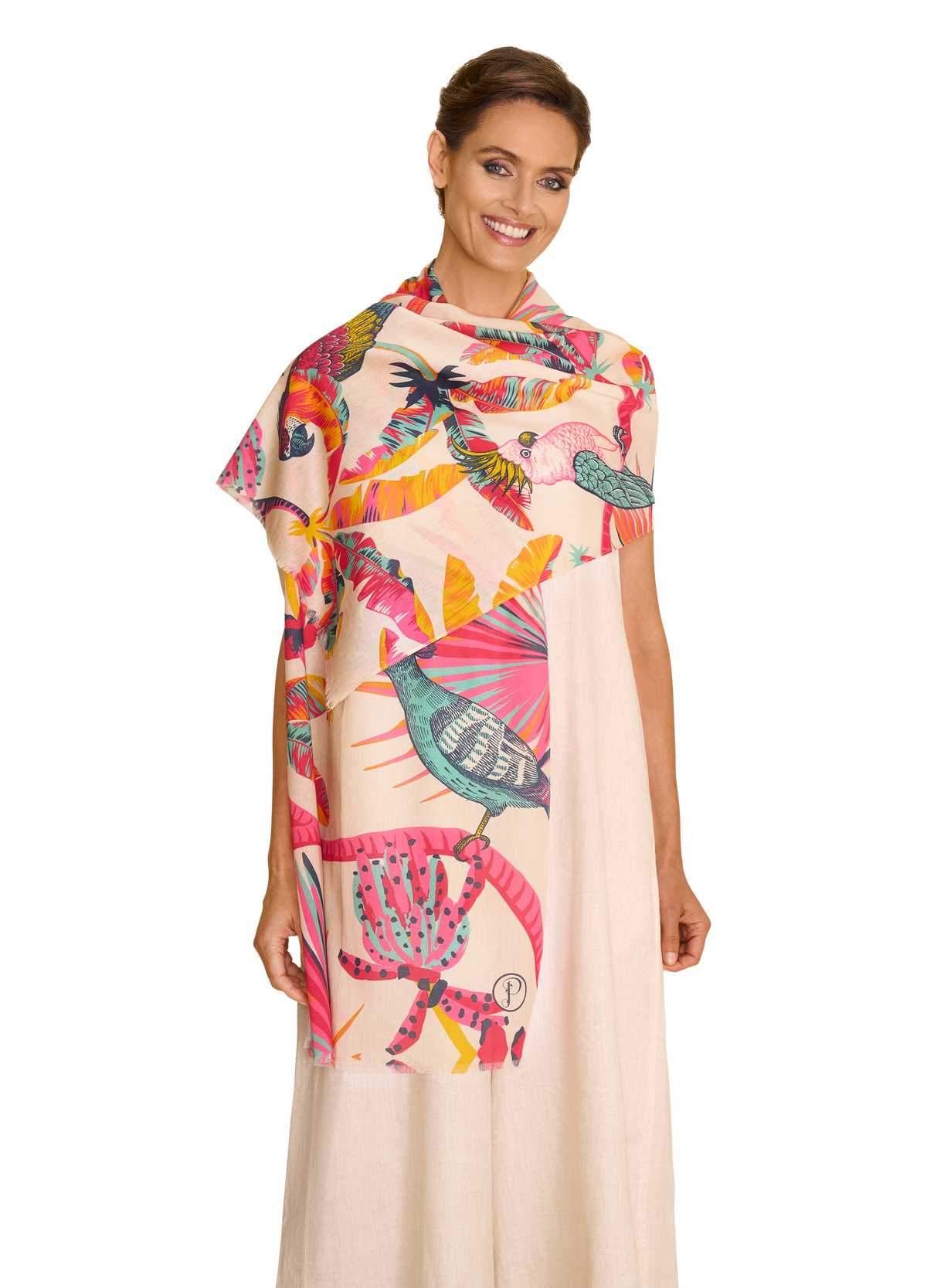 Woman wearing a colorful scarf with a floral and animal pattern on a white background