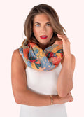 Woman wearing a colorful patterned scarf on a white background