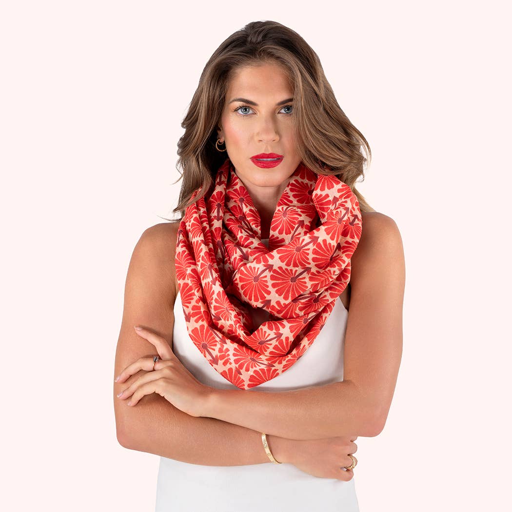 Woman wearing a red floral patterned scarf on a white background