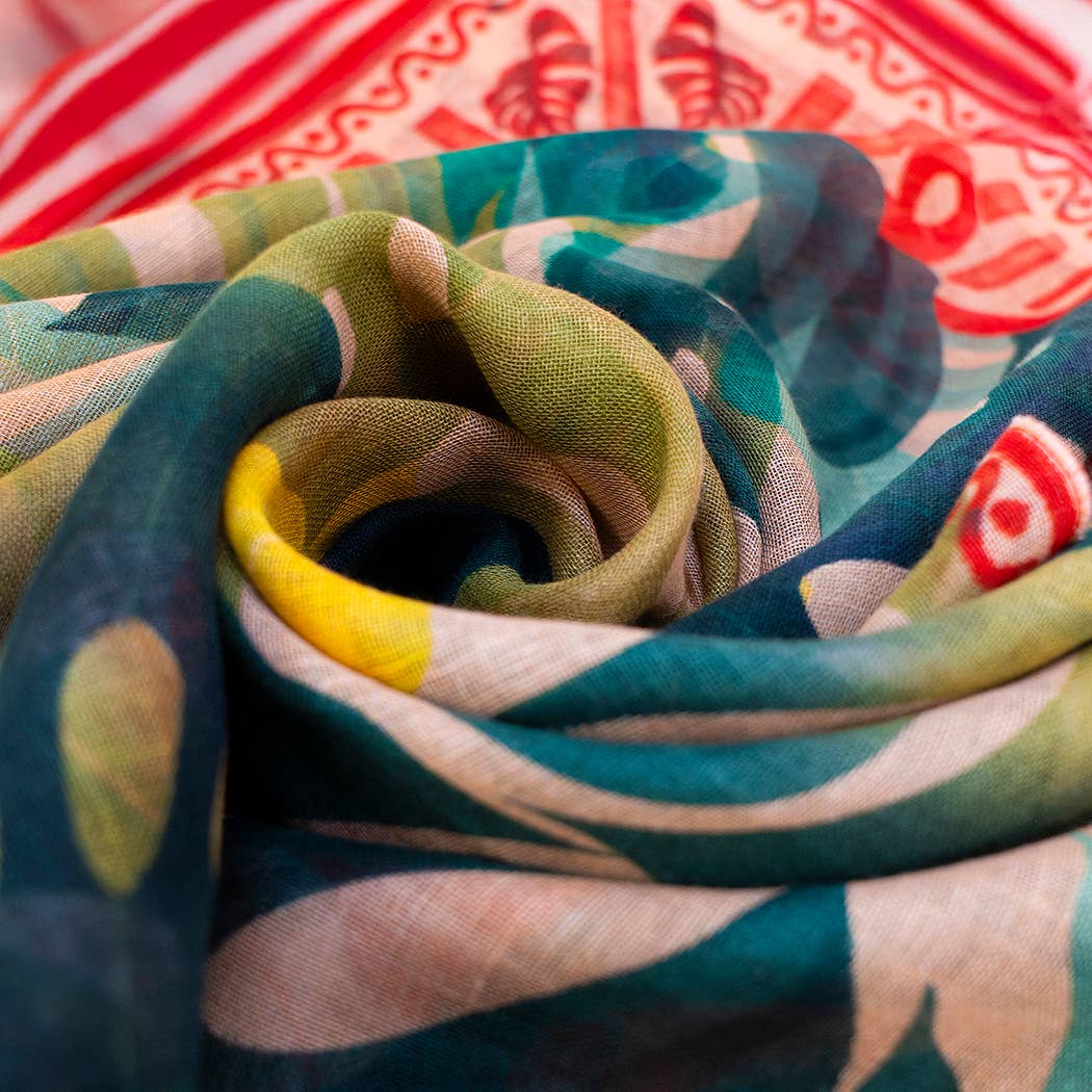 Close-up of colorful fabric with a tropical leaf pattern.