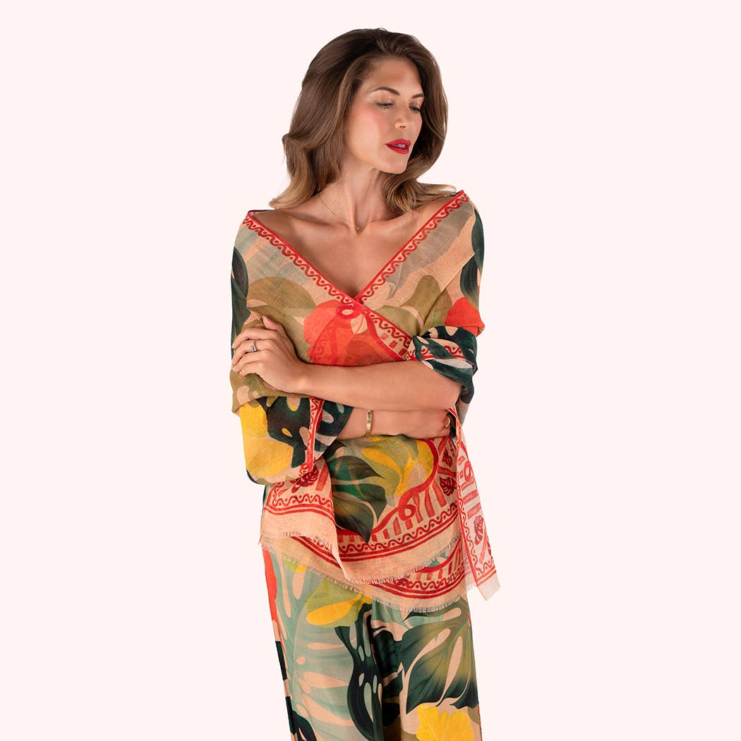 Woman wearing a colorful patterned scarf on a white background