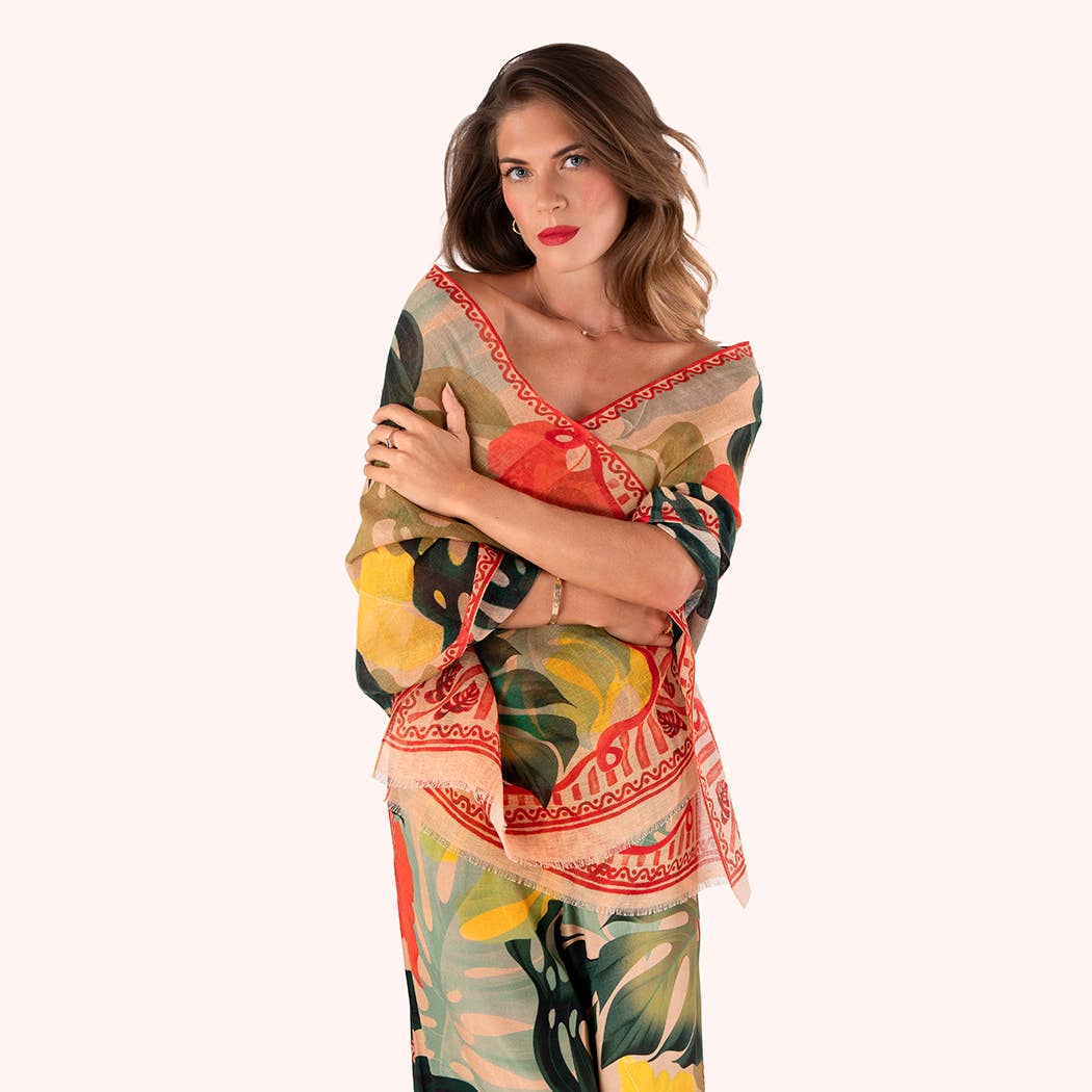 Woman wearing a colorful floral scarf on a white background
