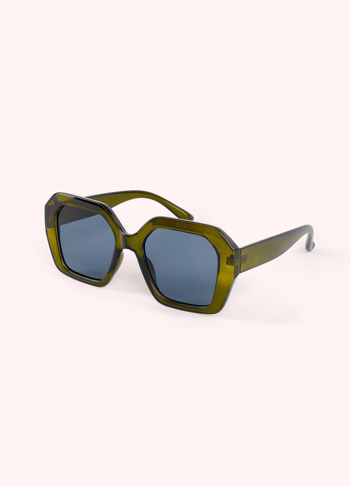 Sunglasses with dark green frame and dark lenses on a white background
