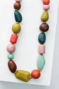 Colorful beaded necklace on a white background