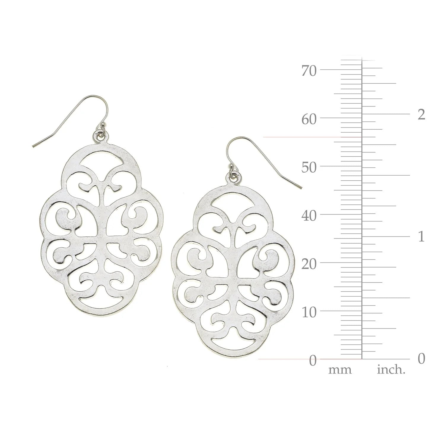 Silver filigree earrings with a measurement scale on a white background