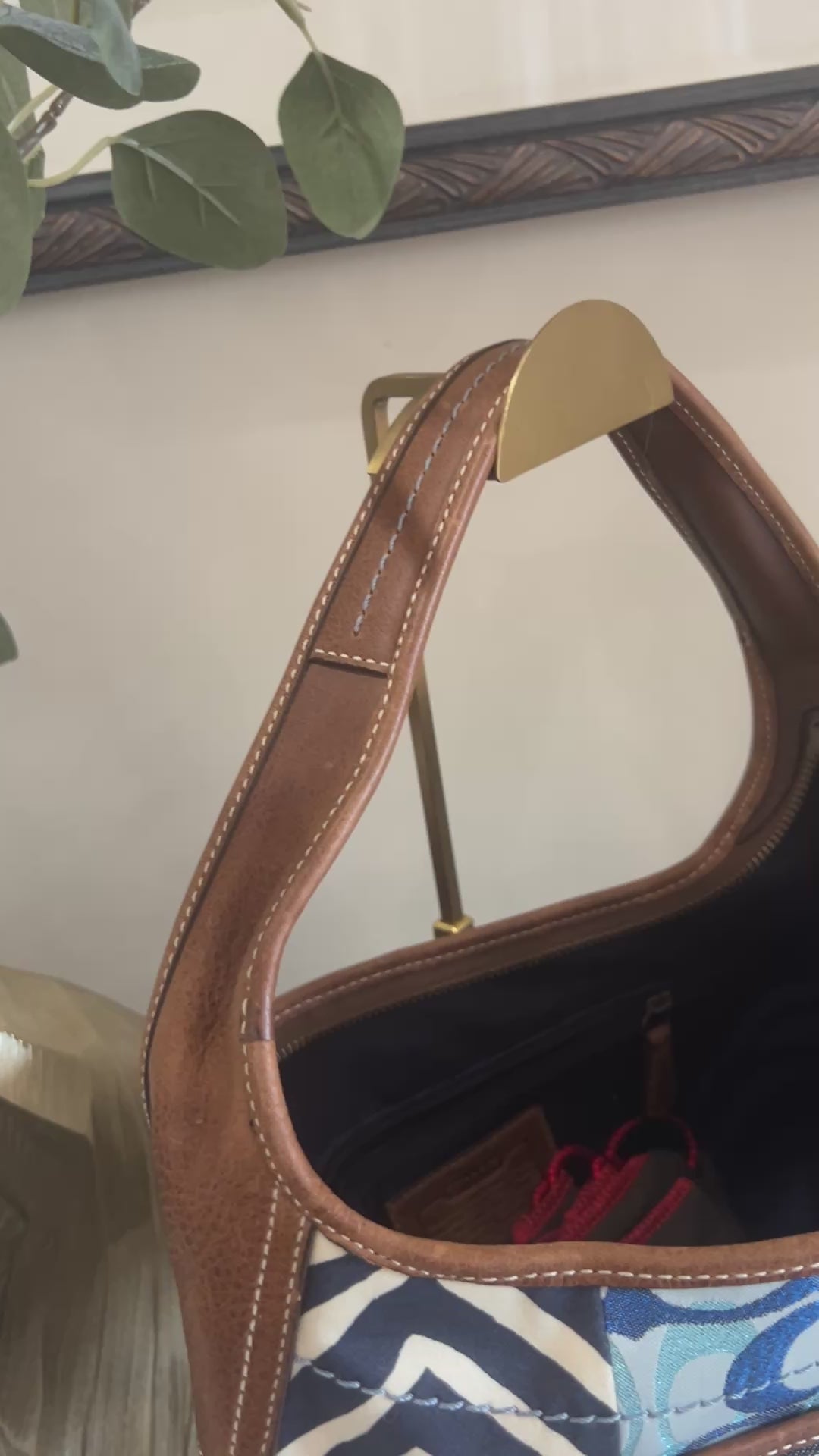 Video scanning over a blue, brown, and purple patchwork bag