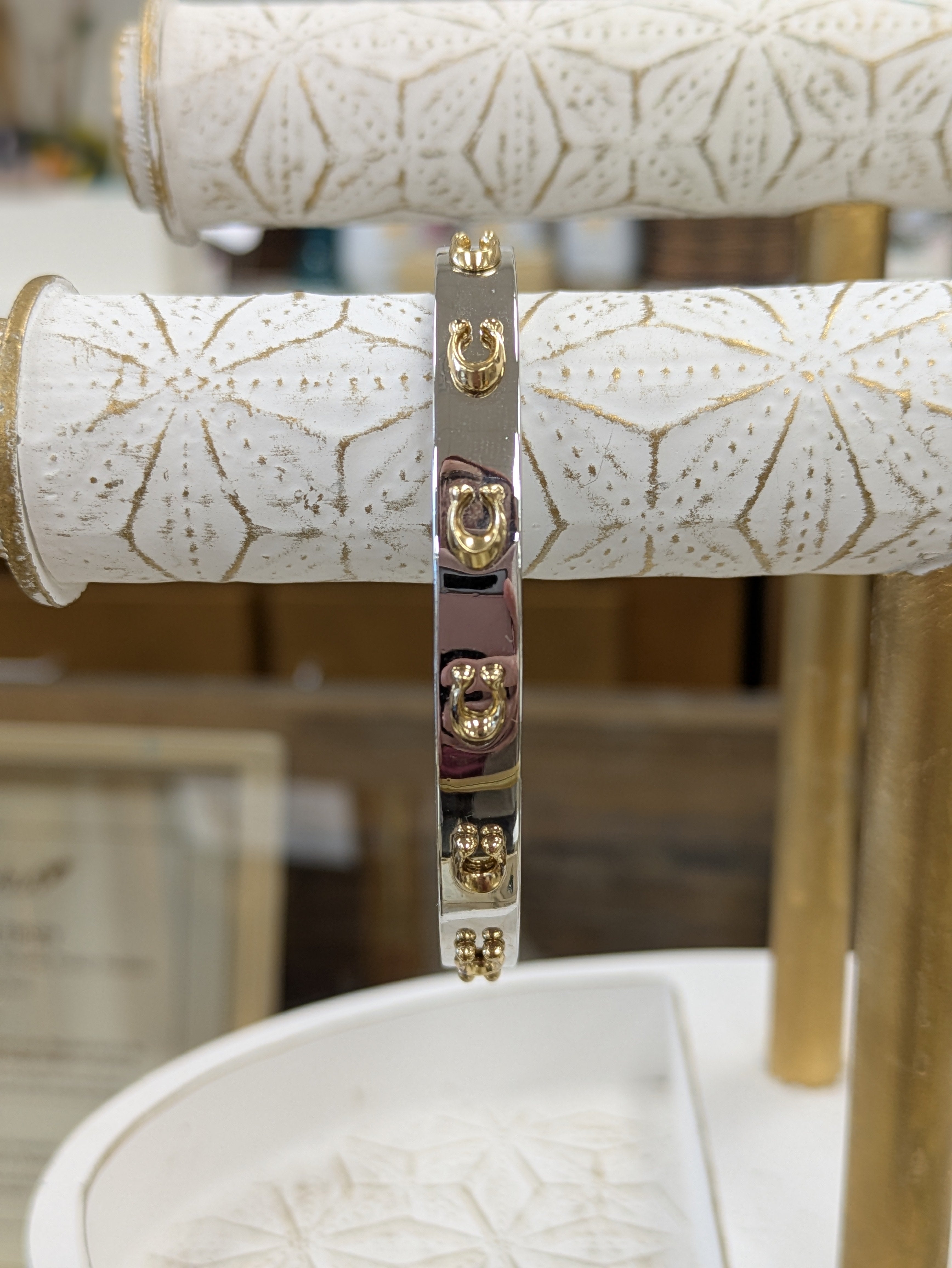 Silver and gold Coach bangle